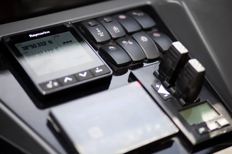  Yacht Photos Pics Control panel of 2022 Princess S66 yacht with navigation and control switches.