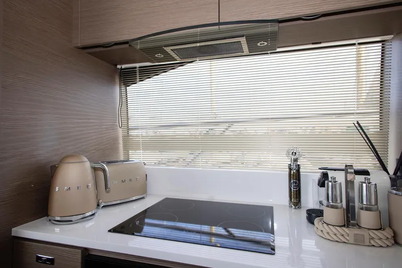  Yacht Photos Pics Modern kitchen in 2022 Princess S66 yacht with SMEG appliances and sleek design.