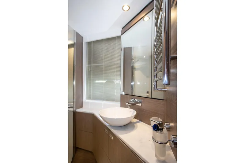  Yacht Photos Pics Luxurious bathroom interior of 2022 Princess S66 yacht with modern fixtures and elegant design.