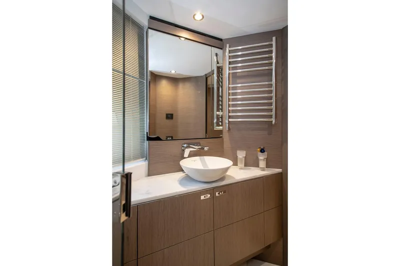  Yacht Photos Pics Modern bathroom interior on 2022 Princess S66 yacht with sleek fixtures and elegant design.