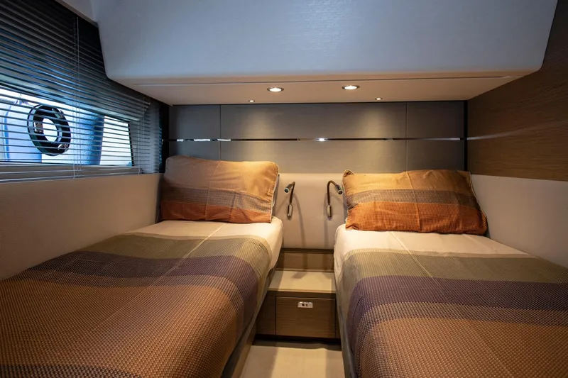  Yacht Photos Pics Luxurious twin cabin interior of 2022 Princess S66 yacht with modern design.