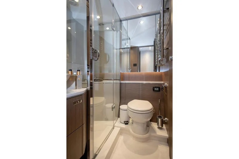  Yacht Photos Pics Luxurious bathroom in 2022 Princess S66 yacht with modern fixtures and elegant design.