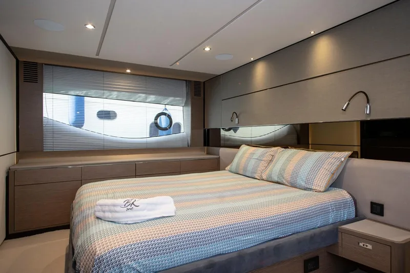 Yacht Photos Pics Luxurious bedroom interior of 2022 Princess S66 yacht with modern design and elegant bedding.