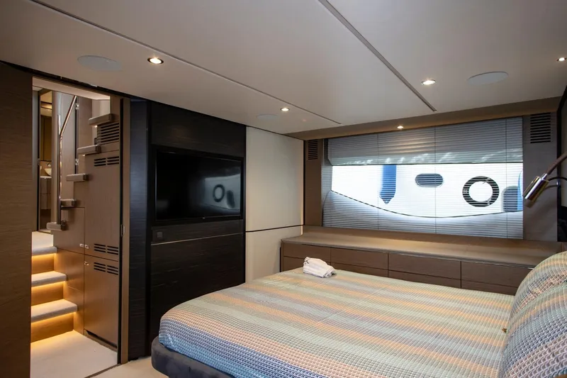  Yacht Photos Pics Luxurious bedroom interior of 2022 Princess S66 yacht with modern design and ambient lighting.