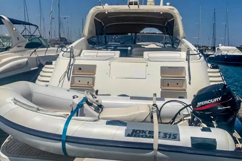  Yacht Photos Pics 2001 Cantieri di Sarnico 45 yacht with inflatable boat and Mercury outboard motor.