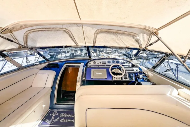  Yacht Photos Pics Interior view of 2001 Cantieri di Sarnico 45 yacht cockpit with steering and seating area.