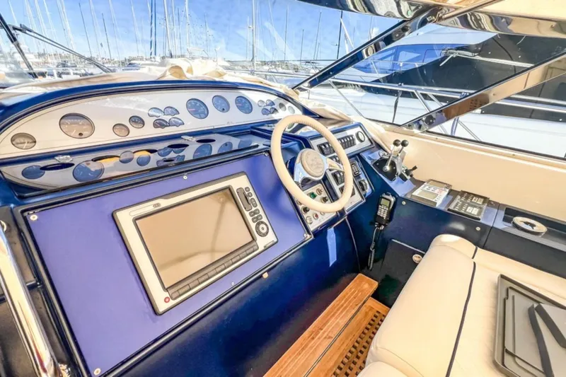  Yacht Photos Pics Cockpit of 2001 Cantieri di Sarnico 45 yacht with navigation instruments and steering wheel.