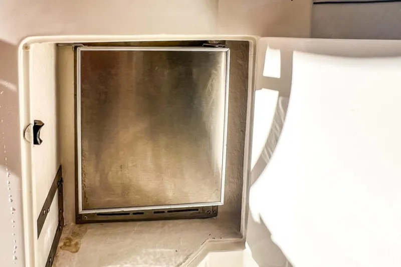  Yacht Photos Pics Stainless steel compartment door on 2001 Cantieri di Sarnico 45 yacht interior.