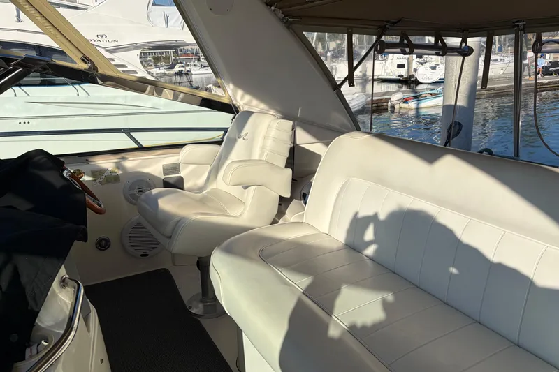  Yacht Photos Pics 1998 Sea Ray 400 Sundancer interior with white leather seating and marina view.