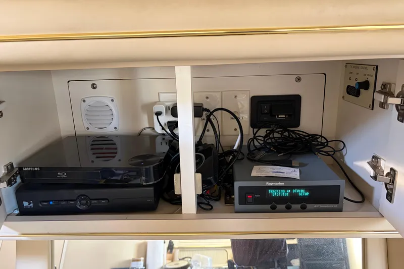  Yacht Photos Pics Electronics cabinet in 1998 Sea Ray 400 Sundancer with Samsung Blu-ray and Raymarine equipment.