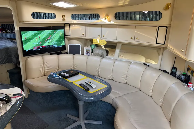 Yacht Photos Pics Luxurious interior of 1998 Sea Ray 400 Sundancer yacht with leather seating and TV.
