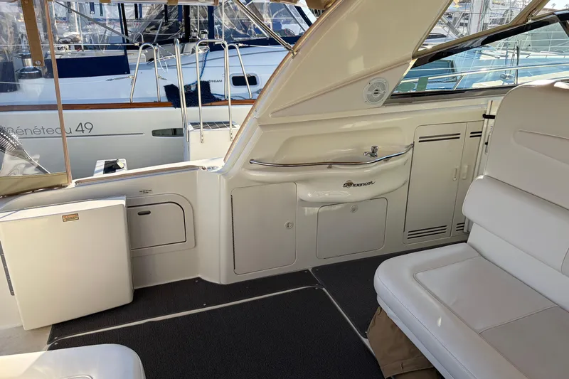  Yacht Photos Pics 1998 Sea Ray 400 Sundancer yacht interior with seating, sink, and storage compartments.