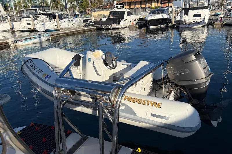  Yacht Photos Pics Inflatable boat with motor docked near Sea Ray 400 Sundancer, 1998 model, in marina.