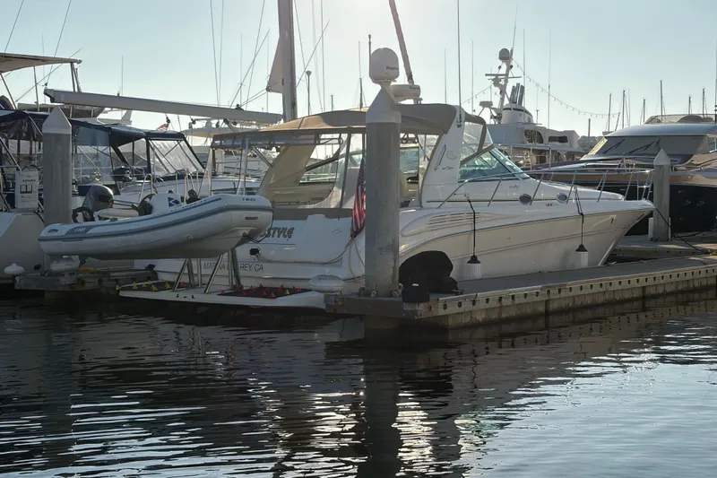  Yacht Photos Pics 1998 Sea Ray 400 Sundancer yacht docked with inflatable boat, marina setting.