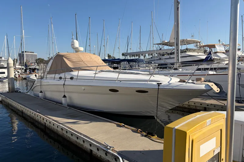  Yacht Photos Pics 1998 Sea Ray 400 Sundancer yacht docked at marina with clear blue sky.