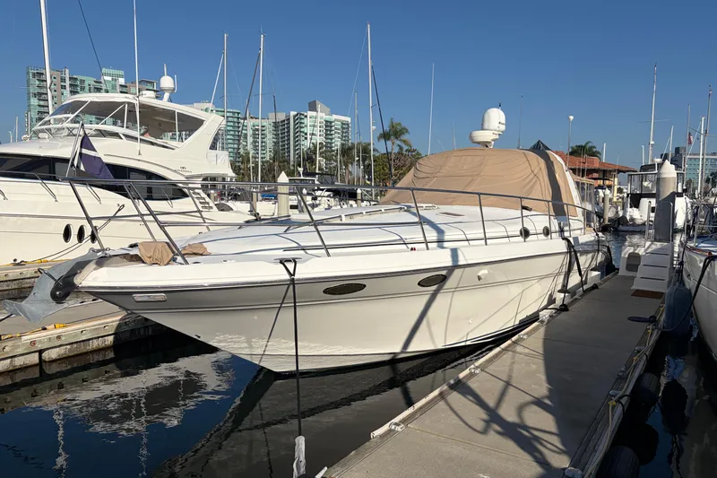  Yacht Photos Pics 1998 Sea Ray 400 Sundancer yacht docked at marina, clear blue sky background.
