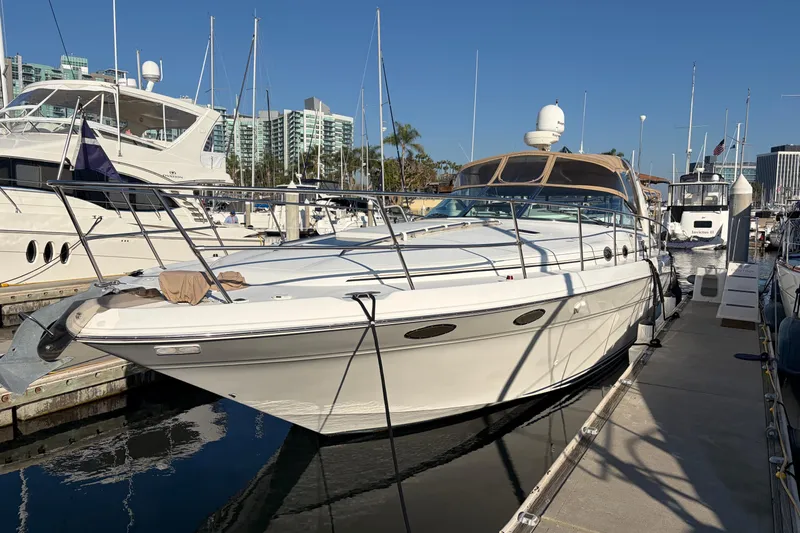  Yacht Photos Pics 1998 Sea Ray 400 Sundancer yacht docked at marina, surrounded by other boats.