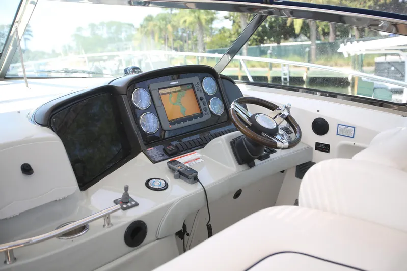 Missy Yacht Photos Pics Cockpit of 2010 Sea Ray 390 Sundancer with navigation system and steering wheel.