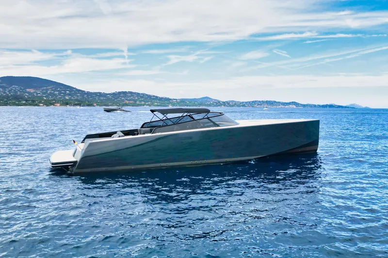 G3 Yacht Photos Pics Luxurious 2013 VanDutch 55 yacht cruising on serene blue waters.