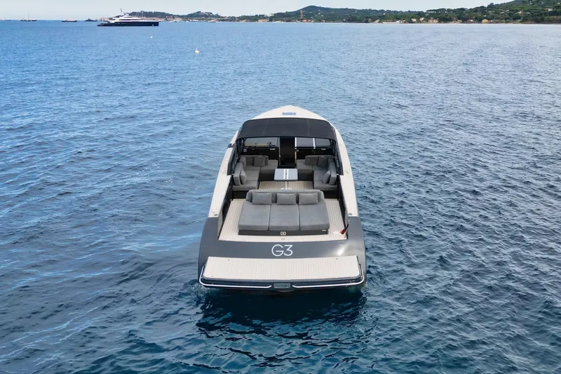 G3 Yacht Photos Pics Luxurious 2013 VanDutch 55 yacht on serene blue waters, showcasing sleek design and spacious deck.