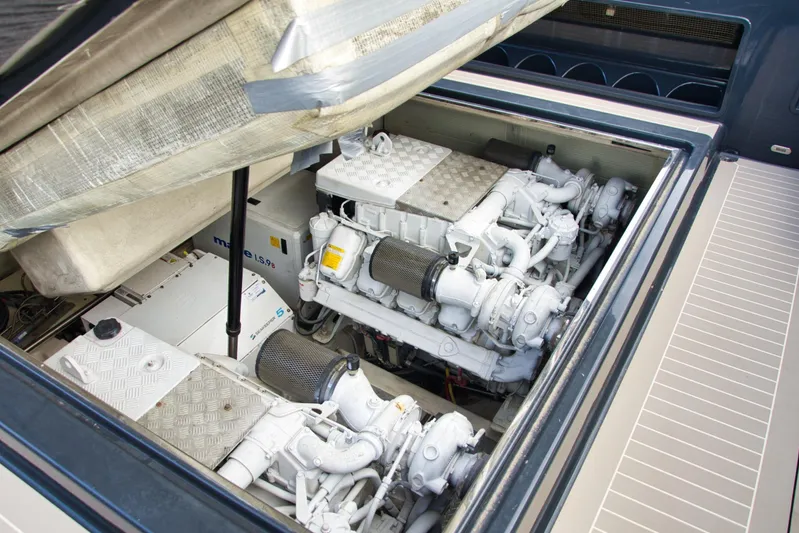 G3 Yacht Photos Pics Engine compartment of a 2013 VanDutch 55 yacht, showcasing dual engines and mechanical components.