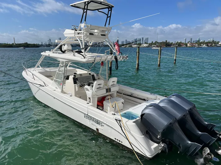  Yacht Photos Pics 2014 Everglades 350LX boat with triple engines on a sunny day.