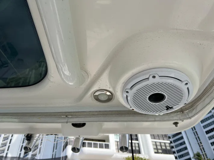  Yacht Photos Pics 2014 Everglades 350LX boat ceiling with speaker and cityscape background.