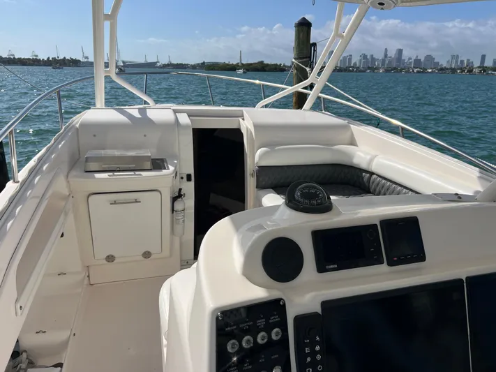  Yacht Photos Pics 2014 Everglades 350LX boat interior with city skyline in background.