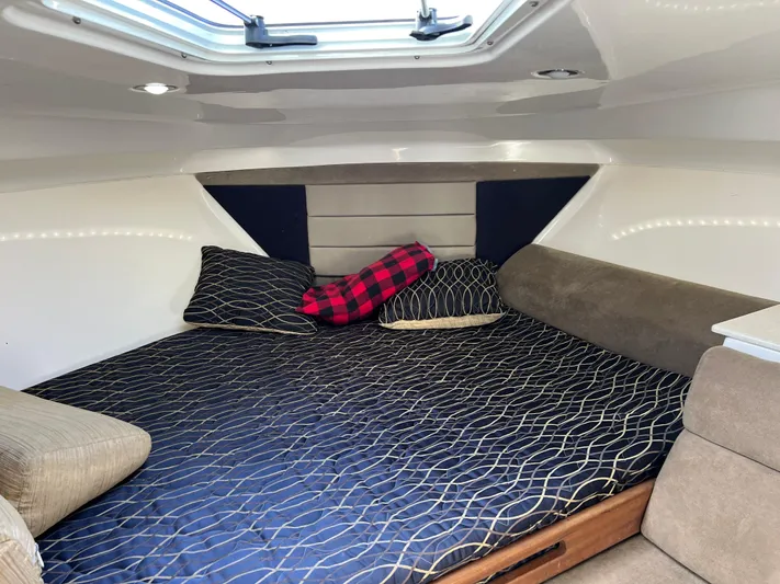  Yacht Photos Pics 2014 Everglades 350LX cabin interior with cozy bedding and pillows.