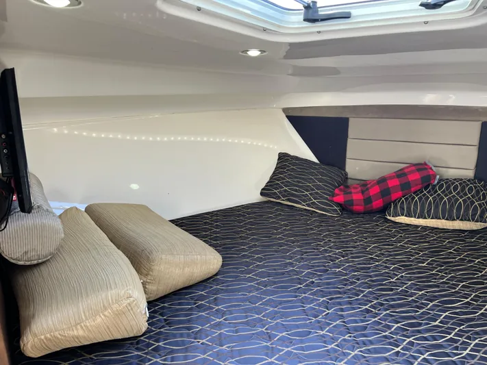  Yacht Photos Pics Cozy cabin interior of 2014 Everglades 350LX with comfortable bedding and pillows.