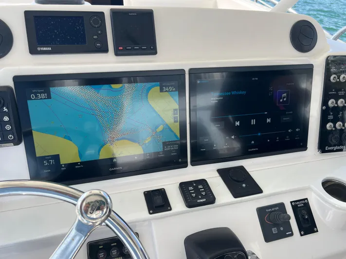  Yacht Photos Pics Dashboard of a 2014 Everglades 350LX boat with navigation and audio displays.