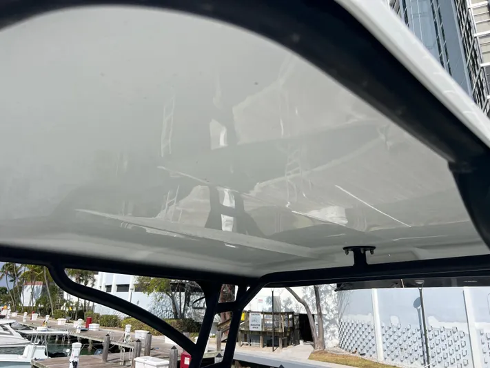  Yacht Photos Pics 2014 Everglades 350LX boat canopy with marina background.