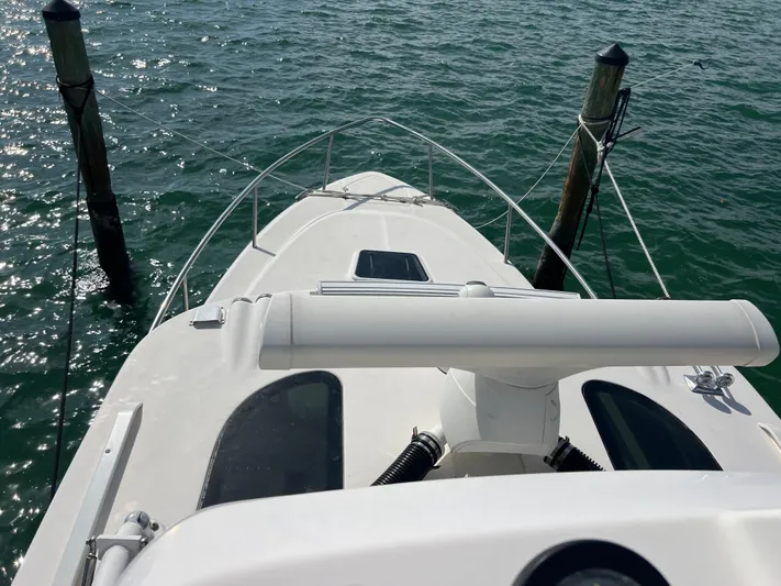  Yacht Photos Pics 2014 Everglades 350LX boat docked on calm water.