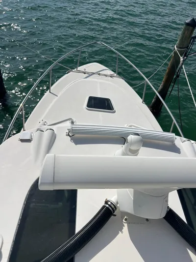  Yacht Photos Pics 2014 Everglades 350LX boat docked on calm water.