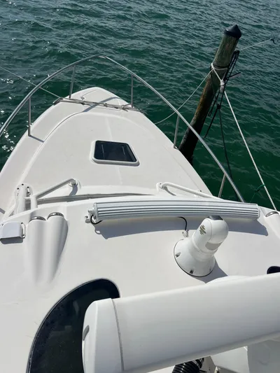  Yacht Photos Pics 2014 Everglades 350LX boat docked on calm water.