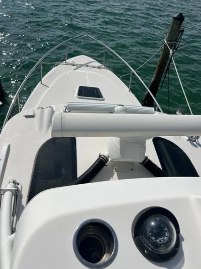  Yacht Photos Pics 2014 Everglades 350LX boat docked on calm water.