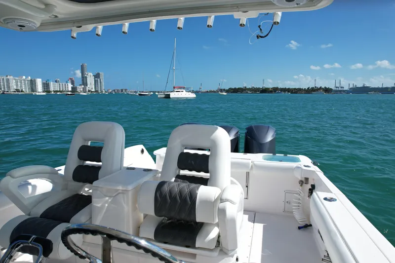  Yacht Photos Pics 2014 Everglades 350LX boat interior with city skyline and ocean view.