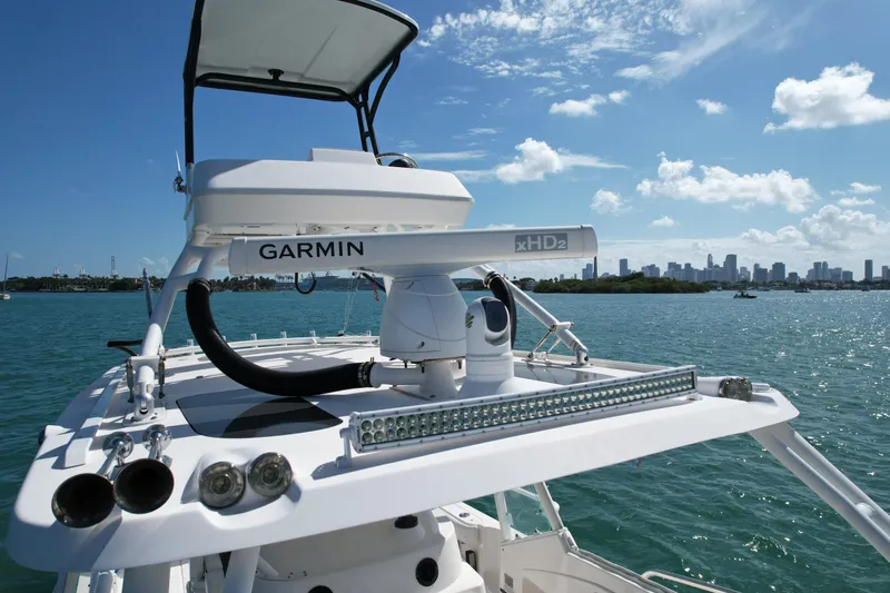  Yacht Photos Pics 2014 Everglades 350LX boat with Garmin radar, city skyline in background.
