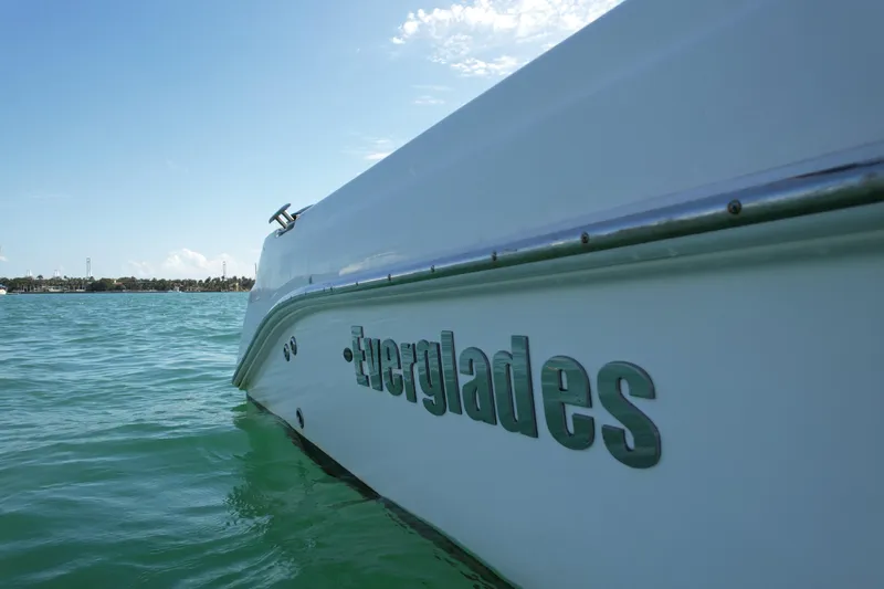  Yacht Photos Pics 2014 Everglades 350LX boat on calm water under clear sky.