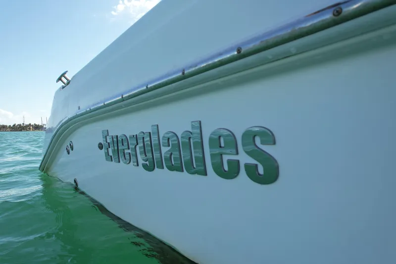  Yacht Photos Pics 2014 Everglades 350LX boat on water, showcasing sleek design and branding.