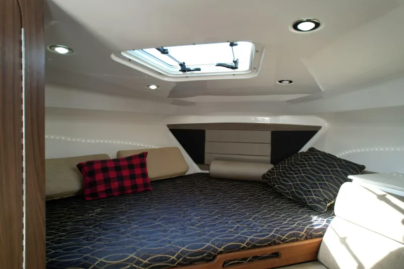  Yacht Photos Pics Cozy cabin interior of 2014 Everglades 350LX boat with stylish bedding and cushions.