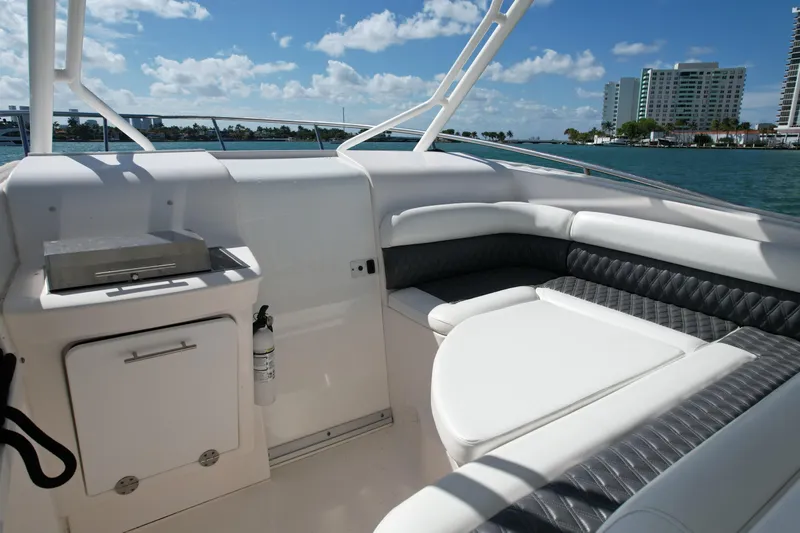  Yacht Photos Pics 2014 Everglades 350LX boat interior with seating and grill, ocean view in background.