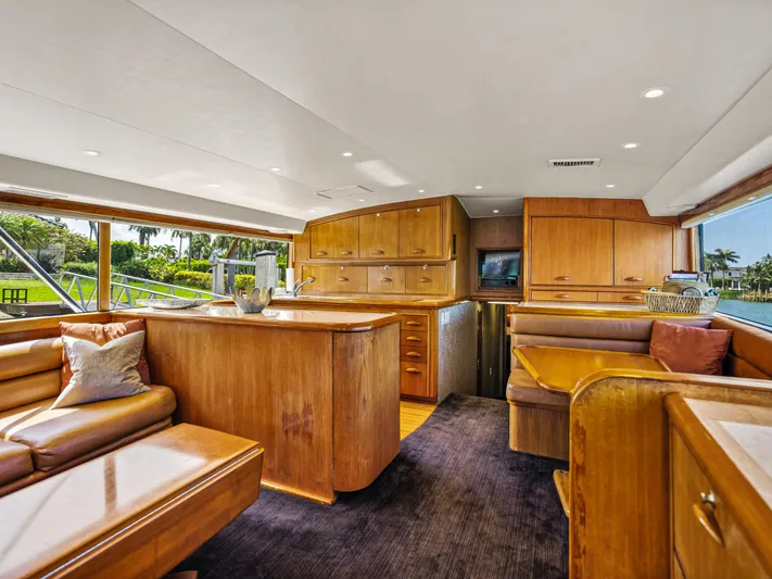 Vintage 1990 Yacht Photos Pics Luxurious interior of a 1990 Buddy Davis 61 Convertible yacht with wooden furnishings.
