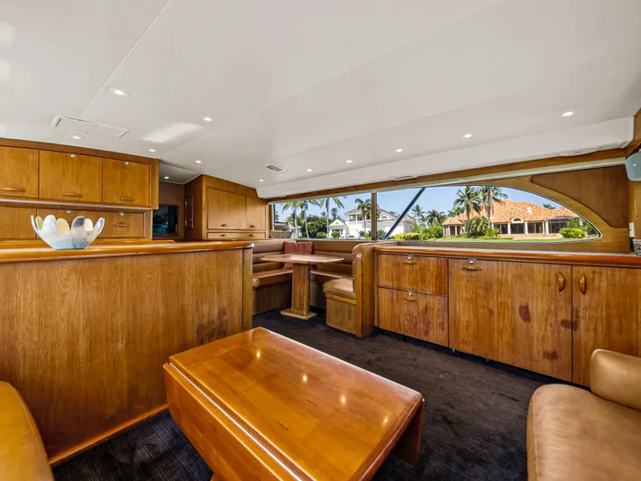 Vintage 1990 Yacht Photos Pics Luxurious interior of a 1990 Buddy Davis 61 Convertible yacht with wooden furnishings.