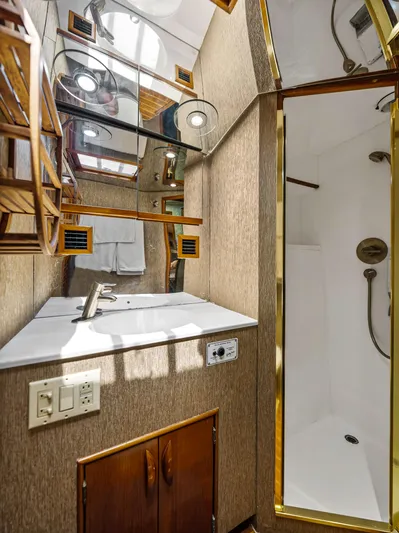 Vintage 1990 Yacht Photos Pics Bathroom interior of a 1990 Buddy Davis 61 Convertible yacht with sink and shower.