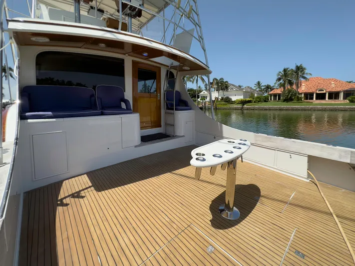 Vintage 1990 Yacht Photos Pics 1990 Buddy Davis 61 Convertible yacht with spacious deck and seating area.