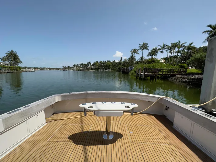 Vintage 1990 Yacht Photos Pics View from the deck of a 1990 Buddy Davis 61 Convertible yacht on a serene waterway.