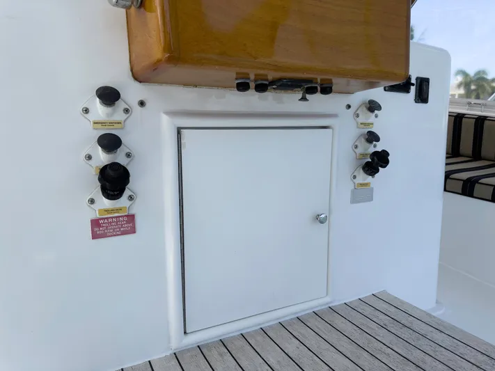 Vintage 1990 Yacht Photos Pics 1990 Buddy Davis 61 Convertible boat control panel and storage compartment.