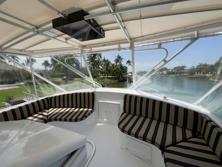 Vintage 1990 Yacht Photos Pics Interior view of 1990 Buddy Davis 61 Convertible yacht with striped seating.
