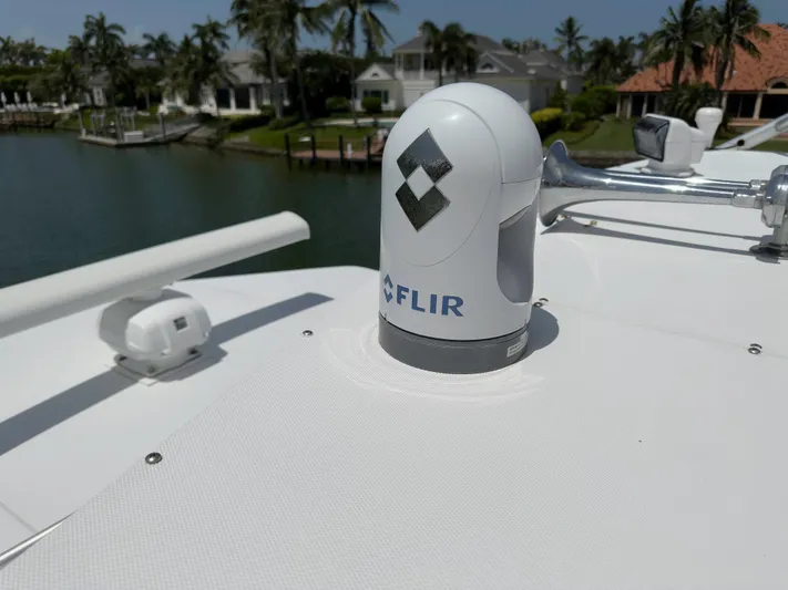 Vintage 1990 Yacht Photos Pics FLIR camera on 1990 Buddy Davis 61 Convertible yacht, docked near waterfront homes.